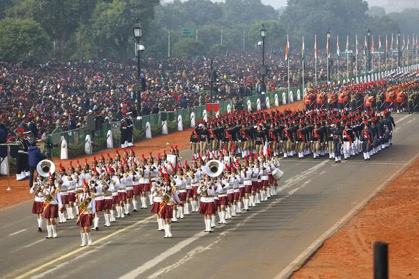 Massed marching contingents and a military band on the Republic Day parade route in New Delhi.